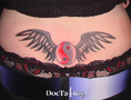 Wings lowerback tattoo