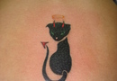 Devil cat lowerback tattoo